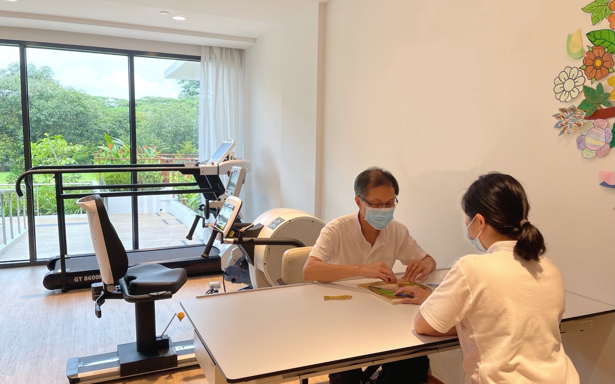 Caregiver gently supporting an elderly person with dementia, reflecting compassionate and personalized care in a calm setting