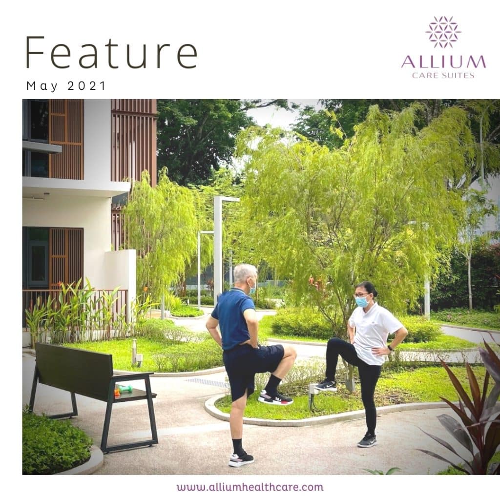 Caregiver assisting a senior with balance exercises to improve stability and mobility