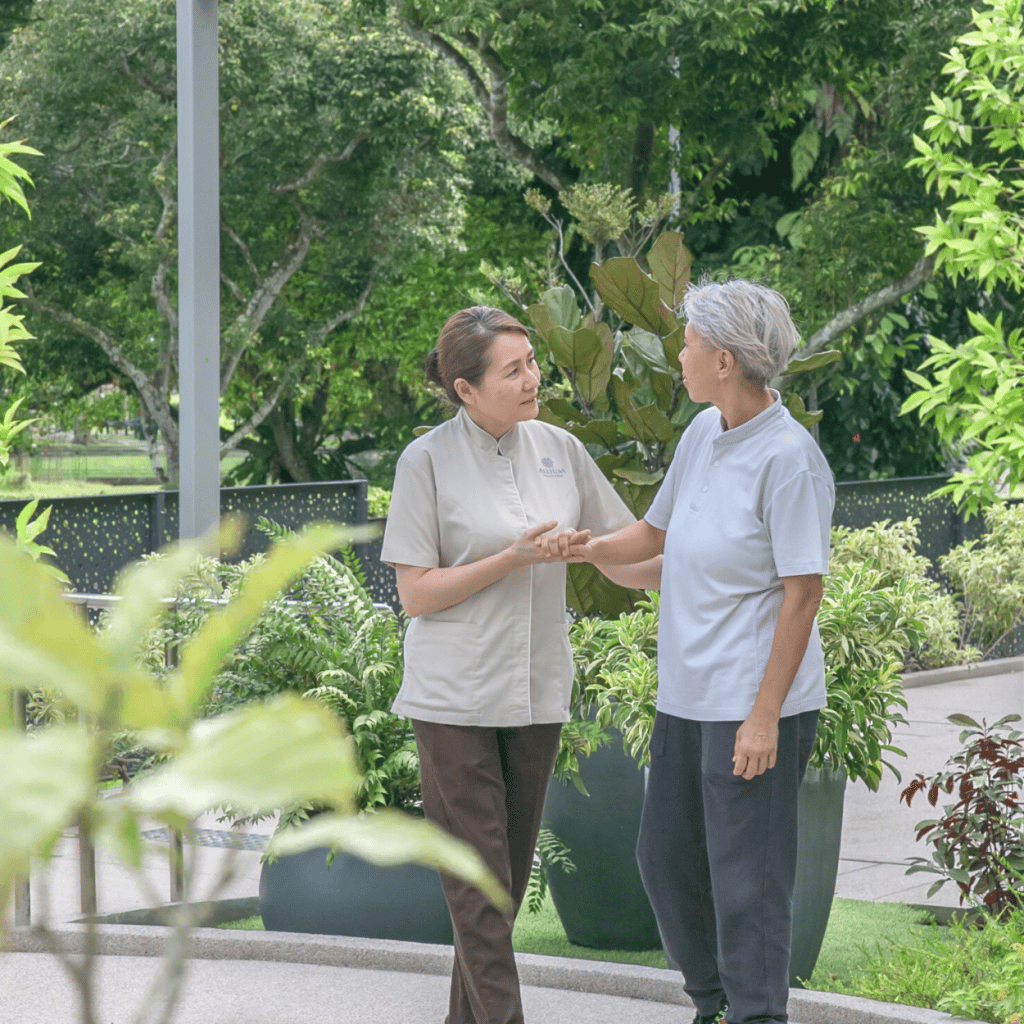 Resident engaging in a meaningful conversation with a caregiver, symbolizing empowerment and personalized care