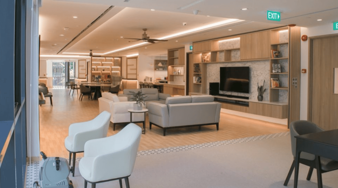 Interior of a thoughtfully designed eldercare suite, blending hospitality and healthcare in a shared living concept