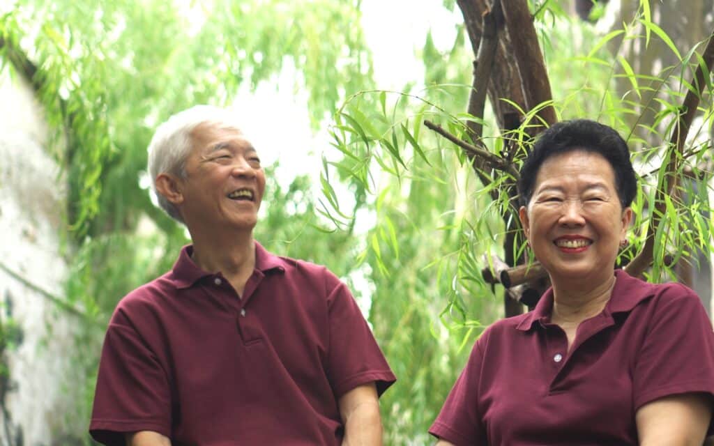 Senior enjoying independent living with support nearby, reflecting a balance of safety, care, and lifestyle