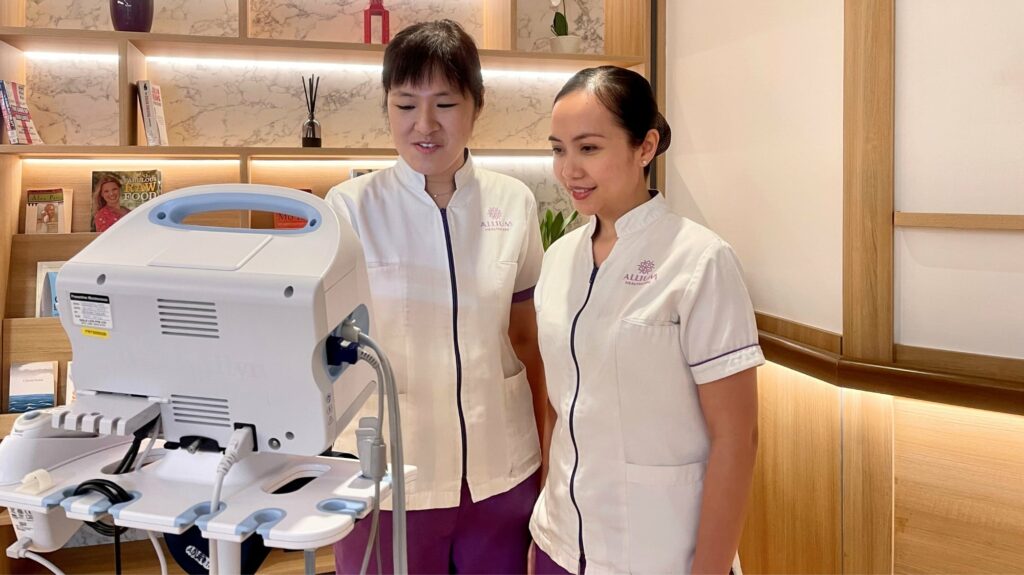 Care team operating medical equipment in a clinical setting